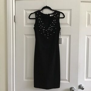 Calvin Klein black dress with white faux pearls in the neckline size 4